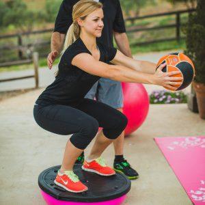 Squat on flat side BOSU-with Medicine Ball